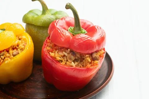 Baked stuffed pepper ( paprika ) with rice , carrot and meat . Top view on .. Stock Photos