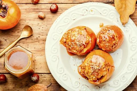Baked stuffed persimmon Stock Photos