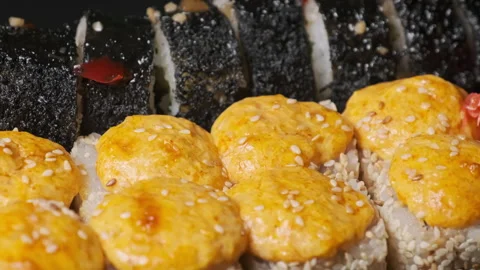 Baked Sushi Rolls in a Plastic Box Rotate Close-Up Stock Footage 253386384