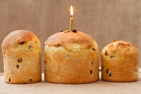 Baked traditional religious easter cake also called kulich with burning candl Stock Photos