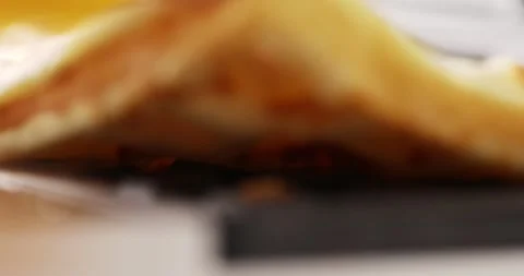 Baked waffle is taken from the surface of the waffle iron. Stock Footage 249595872