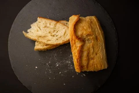 Baked white bread on a black background Stock Photos