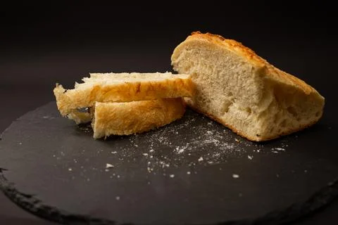 Baked white bread on a black background Stock Photos