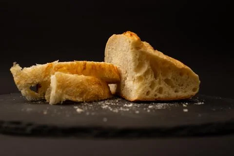 Baked white bread on a black background Stock Photos