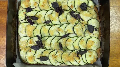 Baked zucchini pizza in deep baking sheet, top view Stock Footage 320258034