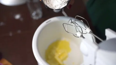 Baker adds flour to the mixer cup, making the dough, housewife cooks in the Stock Footage 71293927