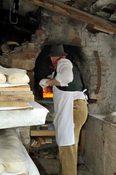 A baker bakes bread Stock Photos