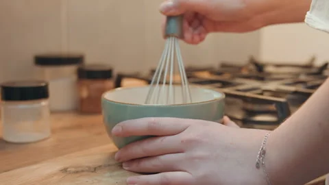 Baker blending batter. Hands mixing smooth dough. Chef whisking mixture on Stock Footage 342336046