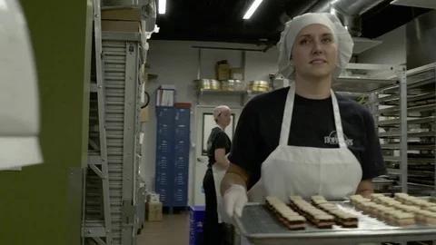 Baker carrying cakes on a tray Stock Footage 77079967