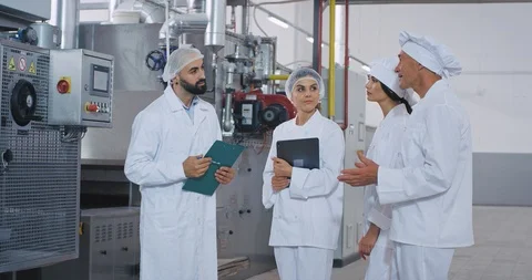 Baker chef old man and young engineer guy with beard have a conversation with Stock Footage 112150660