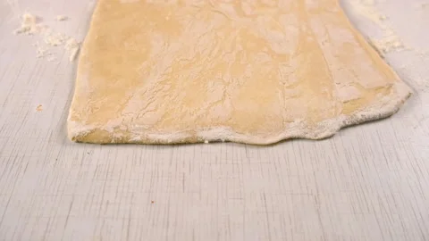 Baker chef woman hands rolling dough with wooden rolling pin cooking dessert. Stock Footage 313040909