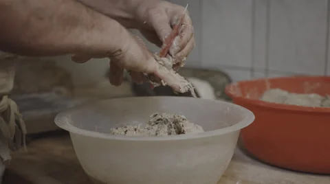 A Baker cleans up his Fingers after he make some Dough Stock Footage 66439264