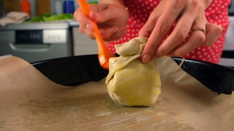 Baker cooking preparing pastry baking smearing dough with butter using brush. Stock Footage 313046164