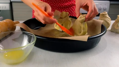 Baker cooking preparing pastry baking smearing dough with egg yolk using brush. Stock Footage 313046255