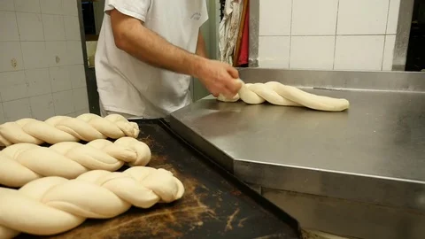Baker creates braids of bread Stock Footage 76184158