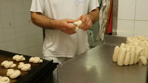 Baker creates forms of bread pasta Stock Footage 76125876