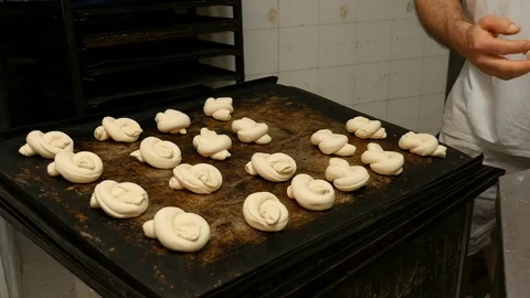 Baker creates forms of bread pasta Stock Footage 76125989