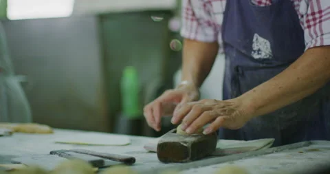Baker Creating Moon Cake Pattern at a Cookie Factory in Miri, East Malaysia Stock Footage 148725439