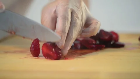 The Baker cuts Strawberries with a Knife Stock Footage 80065838