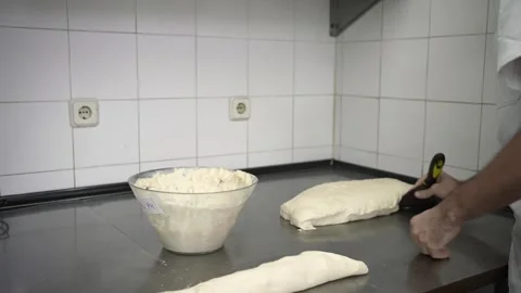 Baker cutting bread dough with sourdough mother 스톡 동영상 251368477
