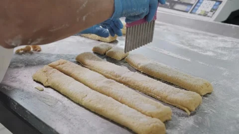 Baker Cutting Cookie Dough Before Baking Stock Footage 321544907