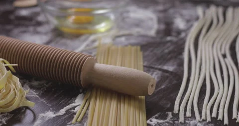 Baker cutting dough and making spaghetti. Stock Footage 138693437