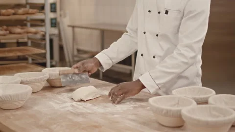 Baker Cutting Dough with Bench Knife Stock Footage 259868333