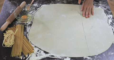 Baker cutting dough for pasta. Stock Footage 138695129