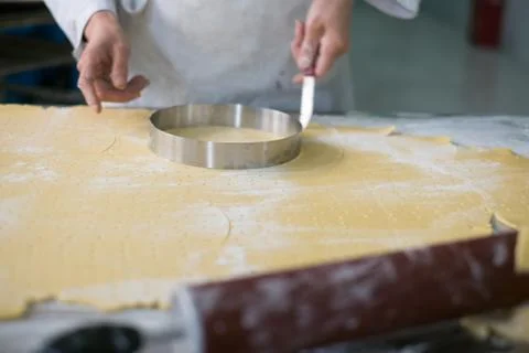 Baker Cutting Pie Crust Stock Photos