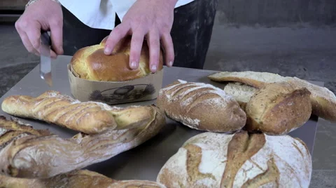 The baker cutting slices of brioche Stock-Footage 56500064