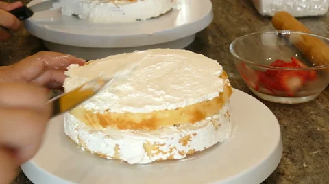 Baker decorate vanilla cake Stock Footage 65968092