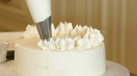 Baker decorate vanilla cake Stock Footage 65968246