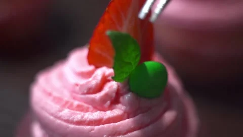 Baker decorates cupcakes Stock Footage 143584010