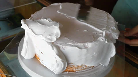 Baker decorating vanilla cake Stock Footage 25038023