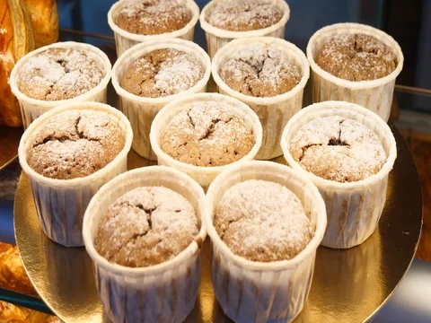 Baker display pastries bakery window buns cakes cookies muffins selection fresh Stock-Footage 84054840