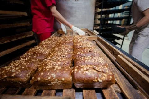The baker folds rye bread Stock Photos