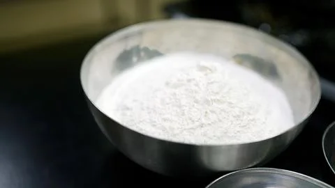 Baker gathering ingredients for baking bread or pizza 스톡 사진