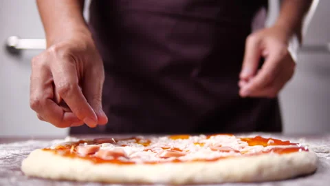 Baker hand making and prepare pepperoni pizza with sausage Stock-Footage 136076099