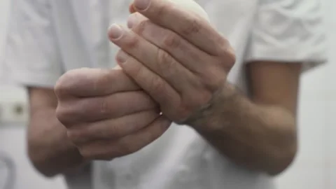Baker handling and shaping raw dough into bread rolls_sourdough bread 스톡 동영상 251364294