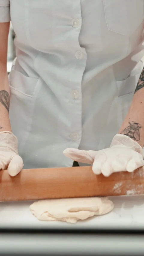Baker, hands and rolling pin with dough, cooking job and preparation for baking Stock Footage 332893281