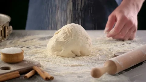 Baker hands are making dough with flour. Stock-Footage 130532363
