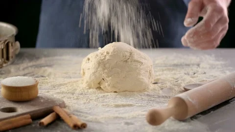 Baker hands are making dough with flour. Stock Footage 131673499