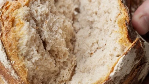 Baker hands breaking bread. Homemade bread breaking. Craft organic bread. Video stock 265024154