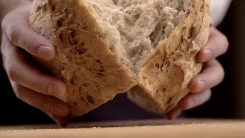 Baker hands breaking homemade bread Stock Footage 123916423