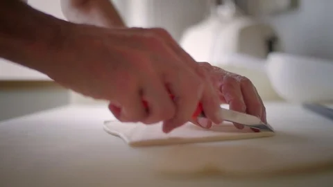 Baker hands cutting the dough Stock Footage 76559247