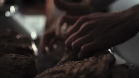 Baker hands kneading dough for bread production in private bakery. Hands shaping Vidéo 347579814