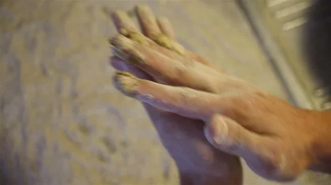Baker hands kneading dough in flour on table Stock Footage 67461093