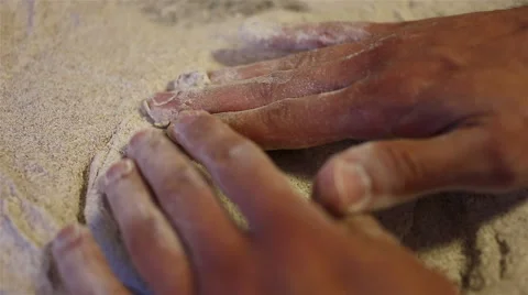 Baker hands kneading dough in flour on table Video stock 67479869