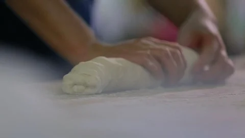 Baker Hands Kneading Dough In Flour On Table 스톡 동영상 89576332