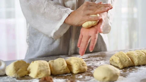 Baker hands kneading dough in flour on table. Stock Footage 96404058